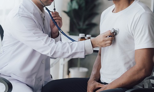Doctor use stethoscope, checking up heart beat, auscultation in doctor office at hospital. Patient worker has to get medical